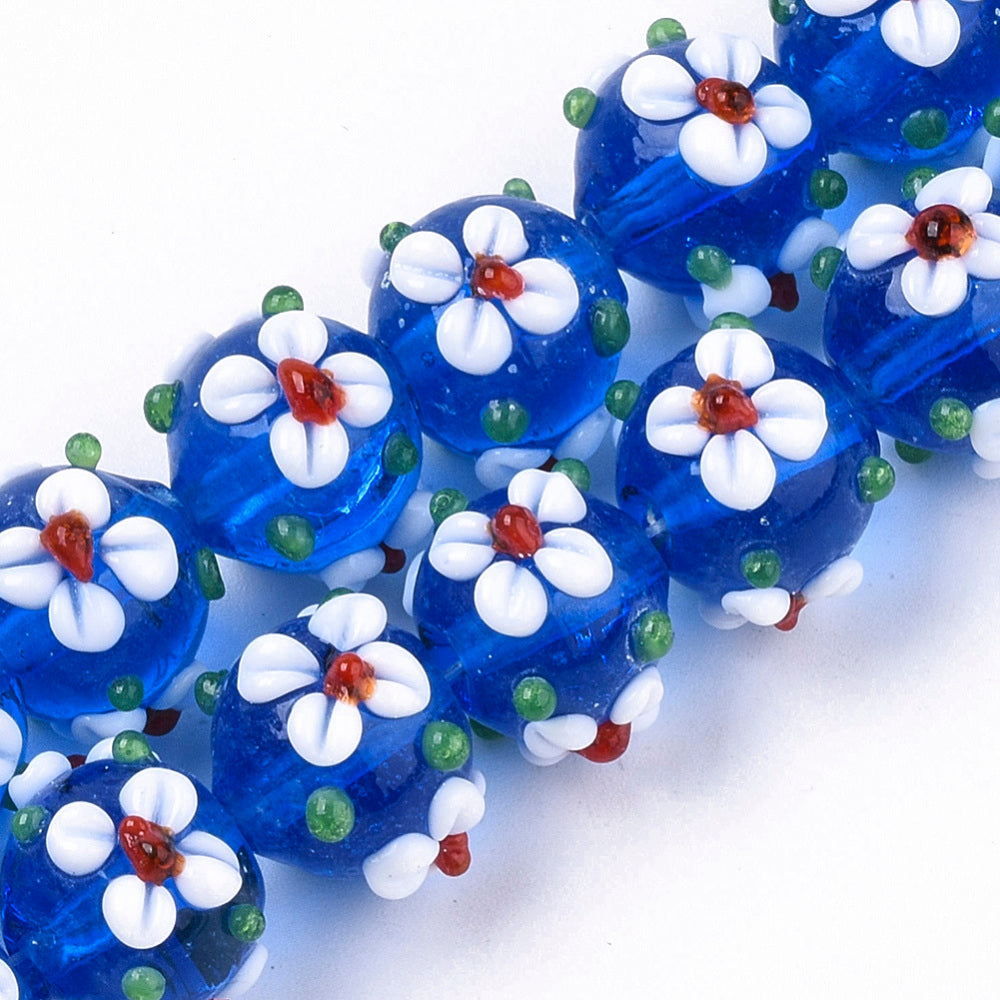 Blue glass bead with flowers