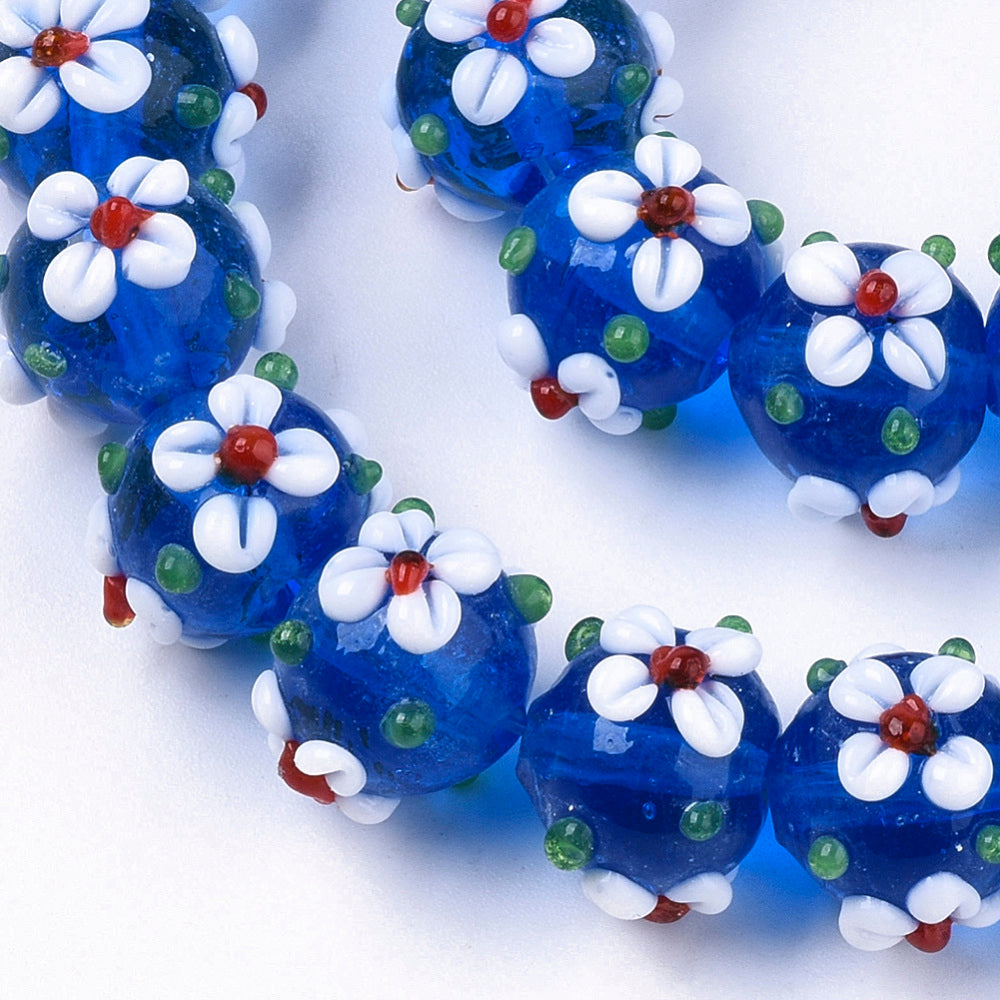 Blue glass bead with flowers