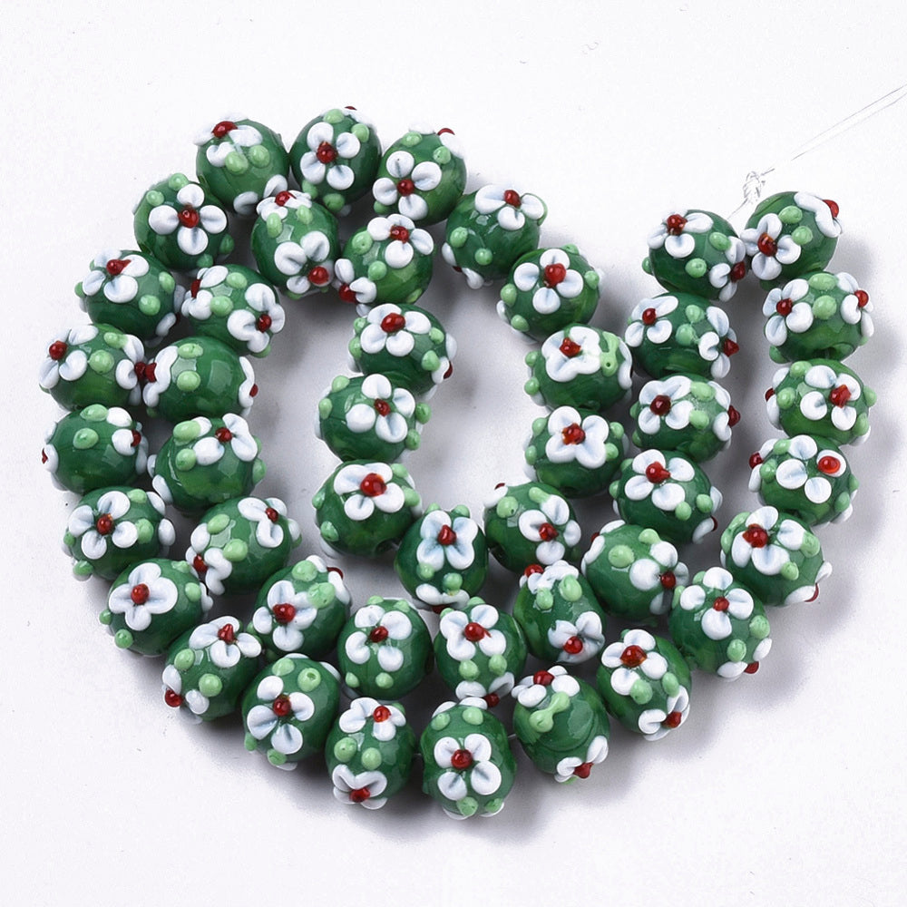 Green glass bead with flowers