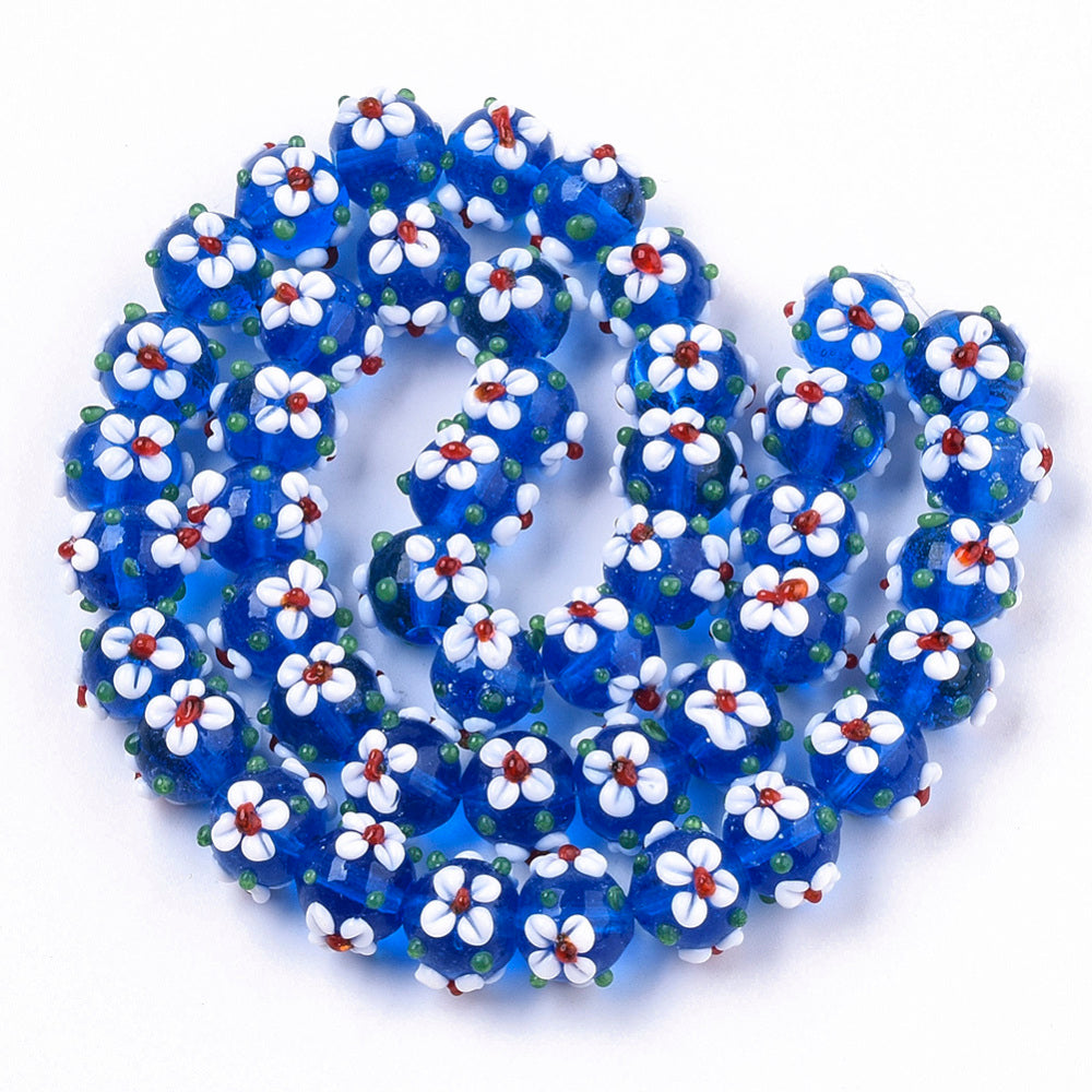 Blue glass bead with flowers