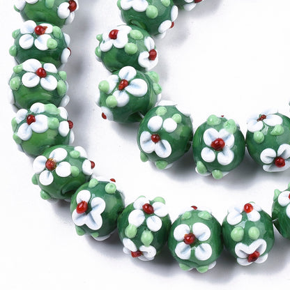 Green glass bead with flowers